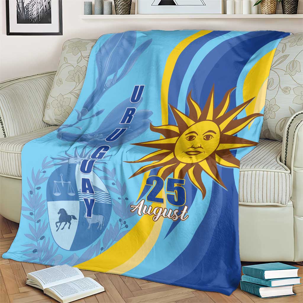 Blue Uruguay Independence Day throw blanket with large sun, "25 August" text and graphics