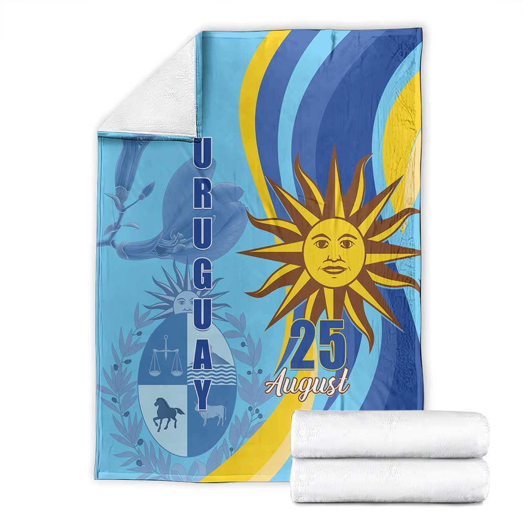 Blue Uruguay Independence Day blanket set with sun "25 August" print and folded white towels