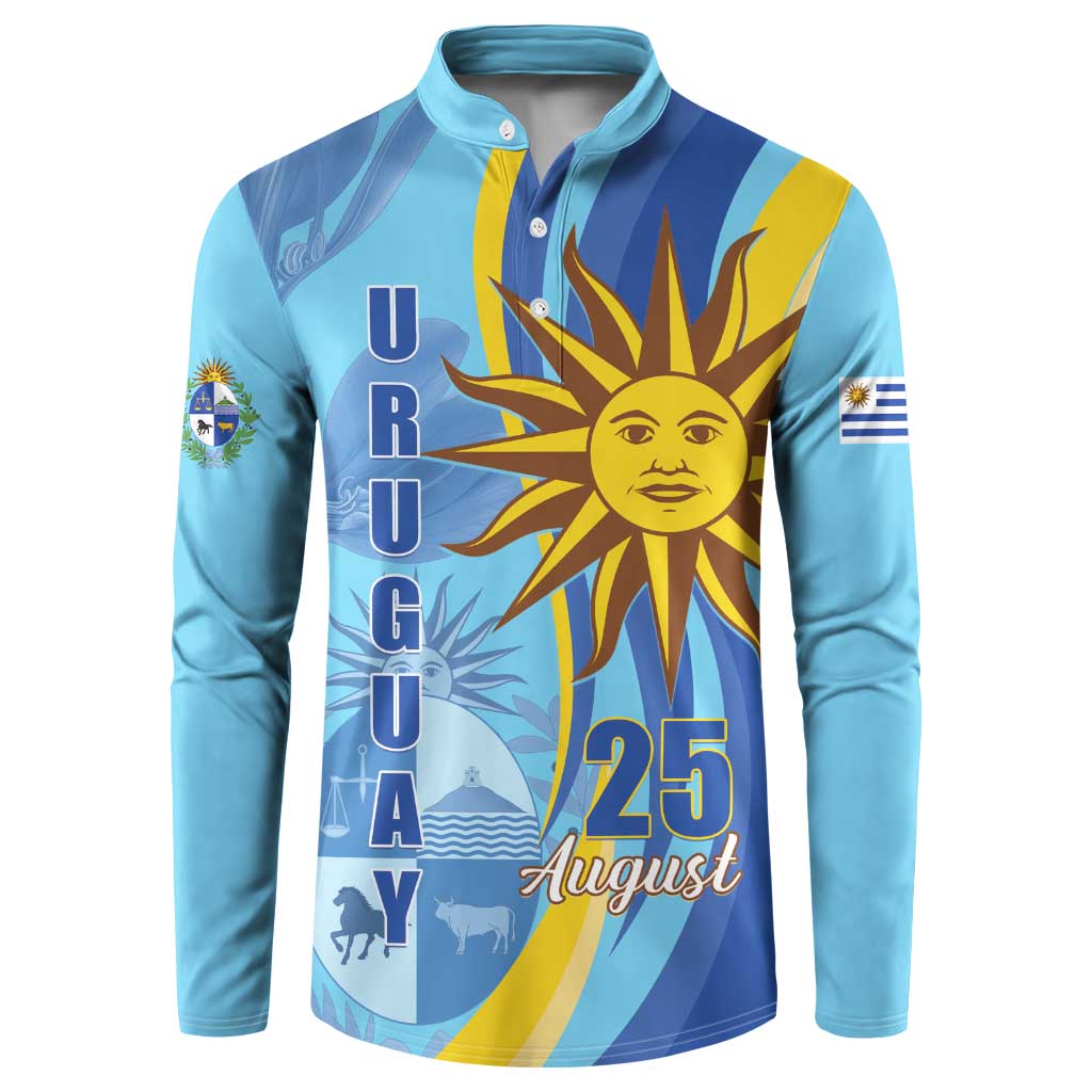 Light blue button sweatshirt with large sun emblem, “URUGUAY” text, and “25 August”