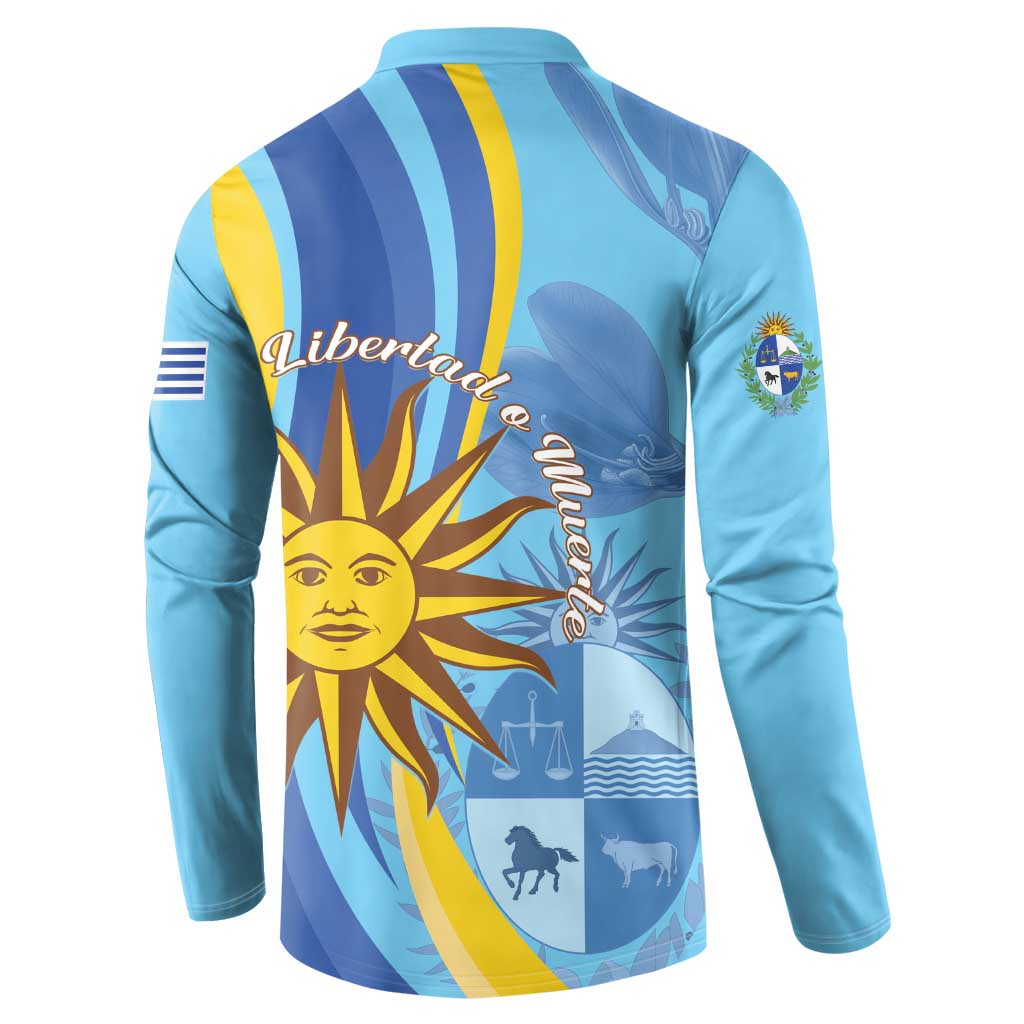 Light blue button sweatshirt with bold sun graphic and Uruguay emblem on back