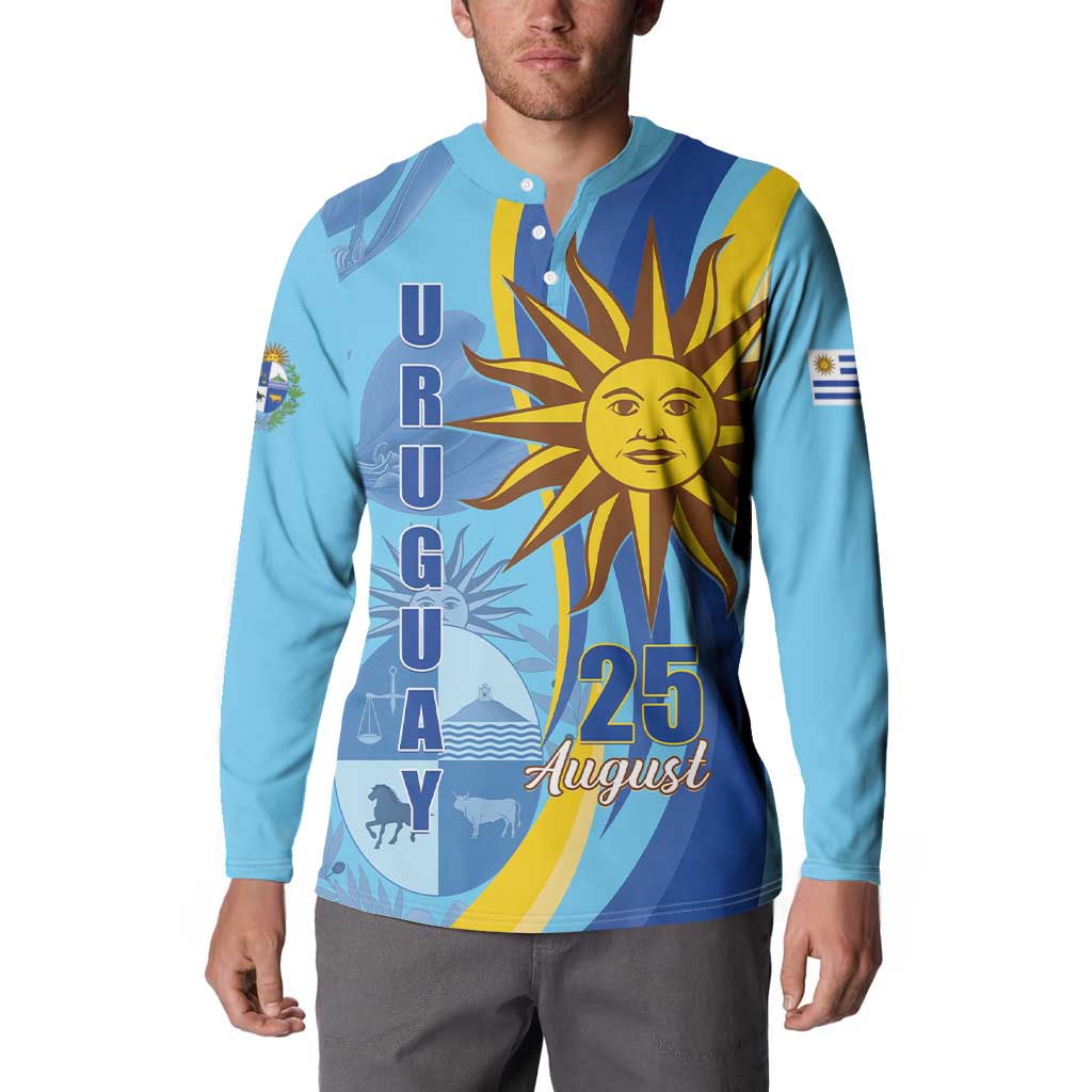 Light blue button sweatshirt with sun graphic and “25 August” lettering on front