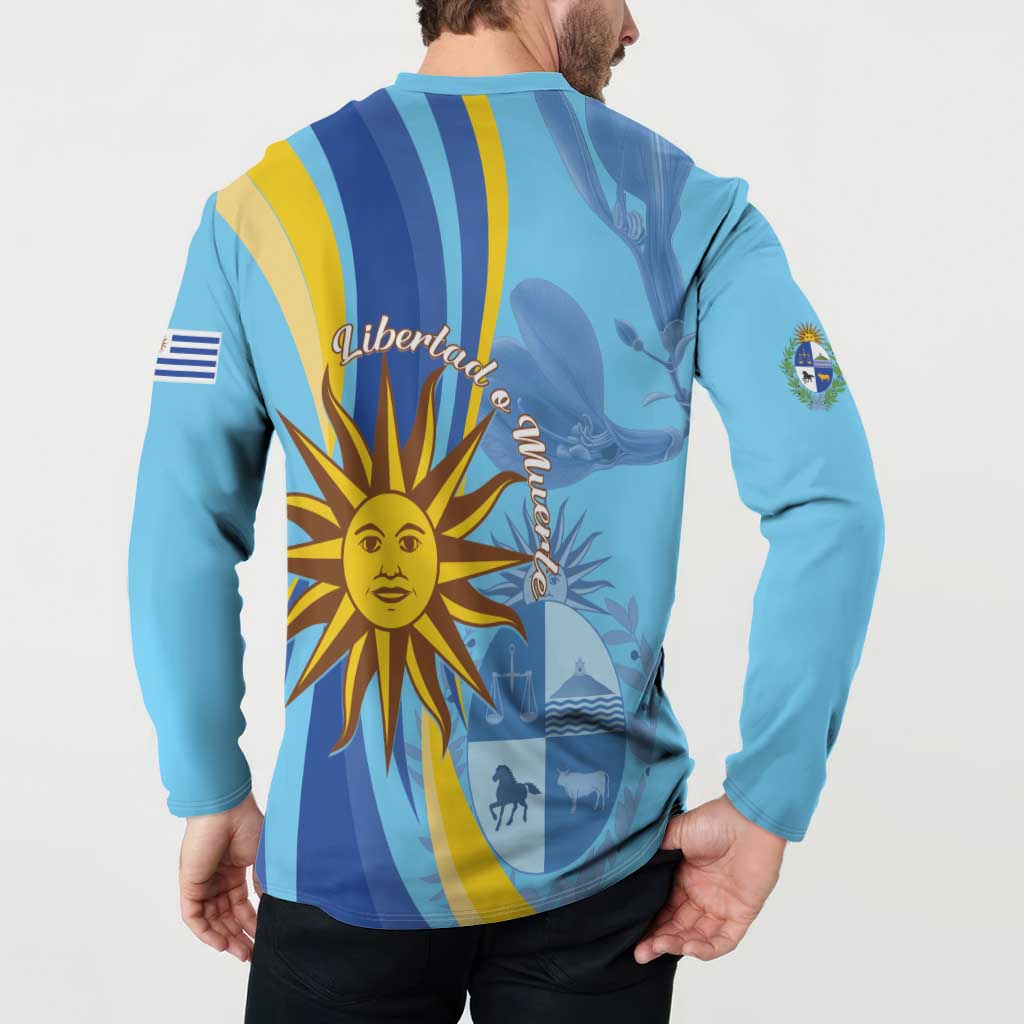 Light blue button sweatshirt with “Libertad” text and sun/Uruguay emblem on back
