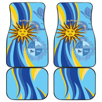 Set of four blue car mats with wavy pattern, sun emblem, and banner