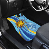 Blue front car floor mat with sun emblem, waves, and circular crest