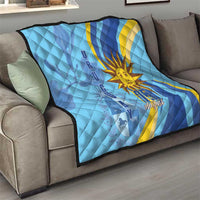 Light blue quilt with yellow sun graphic, dark blue border, and “25 August” text