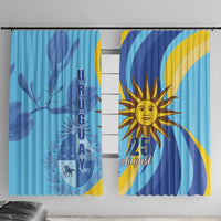 Blue window curtain set with Uruguay emblem, sun graphic, and blue-yellow wave details.