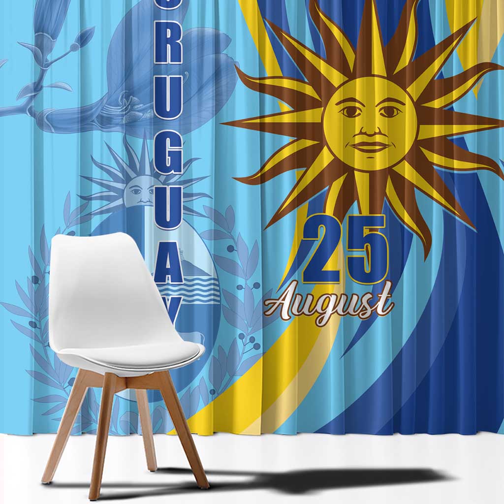 Blue window curtain with sun emblem and vertical “URUGUAY” lettering on a blue background.