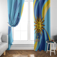 Blue window curtain with sun face and “25 August” print, plus yellow-blue curved accents.