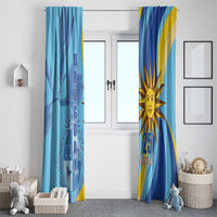 Blue window curtain pair with Uruguay “URUGUAY” text panel and sun “25 August” design.