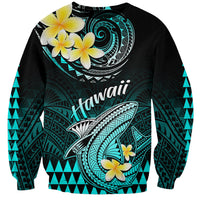 Turquoise and black sweatshirt with Polynesian shark, plumeria flowers, and Hawaii text
