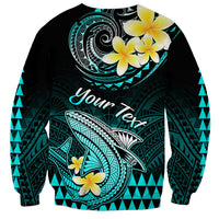 Turquoise and black sweatshirt with Polynesian shark, plumeria flowers, and “Your next” text