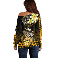 Women’s off-shoulder sweater, back view, dark with gold/yellow shark and floral design