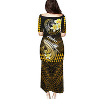 Back view gold-and-black Polynesian shark print long dress, short sleeves, Aloha text