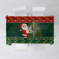 Christmas tablecloth with Santa illustration and green geometric border pattern