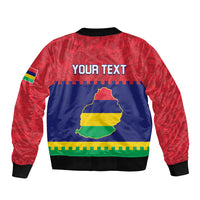 Unisex bomber jacket with red patterned sleeves, navy back, zipper, island map graphic