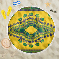 Round yellow beach blanket with green and blue dashiki pattern and white fringe border