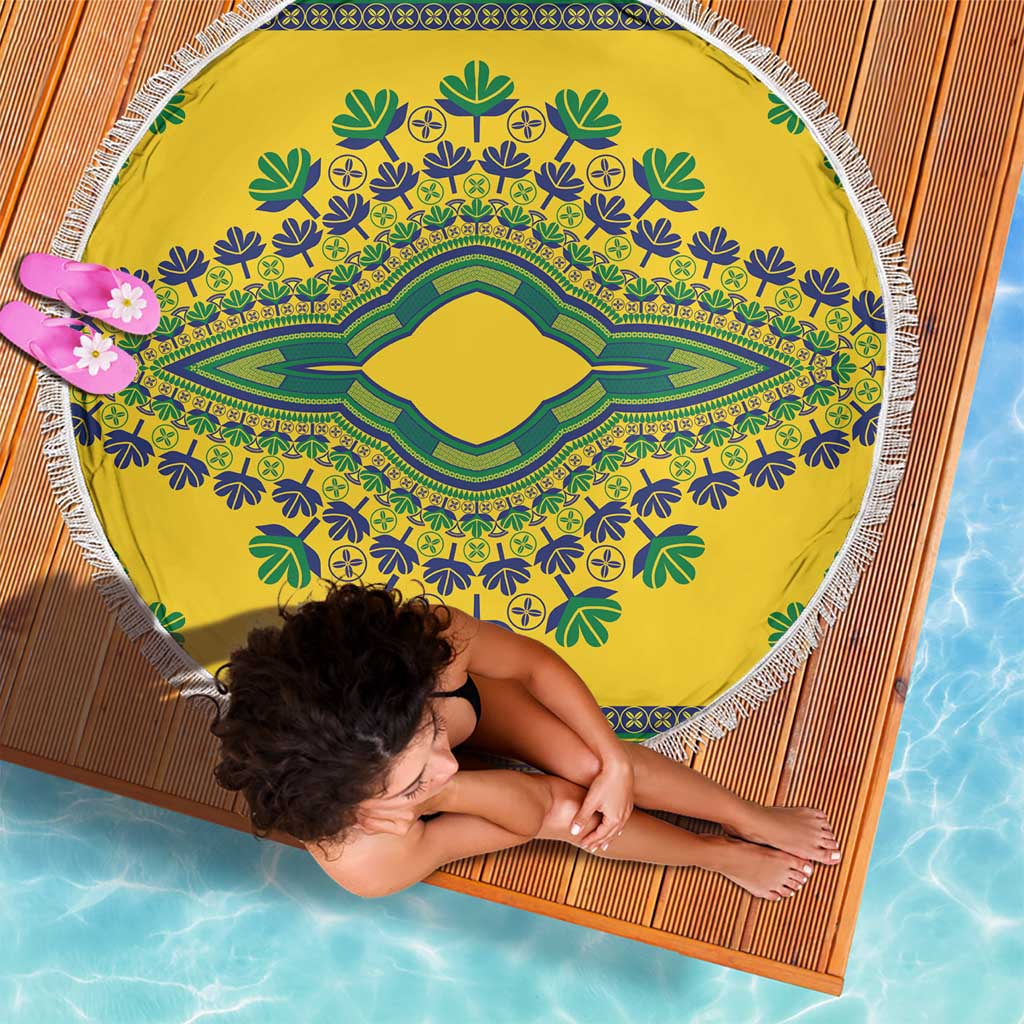 Round yellow beach blanket with green and blue dashiki medallion design and white fringe edge