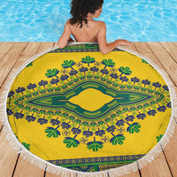 Round yellow beach blanket with green and blue dashiki medallion and white fringe