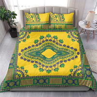 Yellow dashiki bedding set on bed, two matching pillowcases with green and blue border print