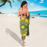 Yellow and green printed sarong worn from behind, tie at the waist