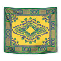 Yellow square tapestry with teal-green border, geometric trim, and central oval medallion