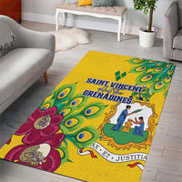 Yellow area rug with peacock feather motif, magenta flowers, and blue banner text
