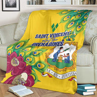 Yellow peacock-feather blanket on a sofa with bold blue title text and a decorative border