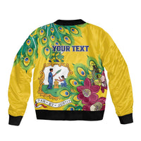 Yellow bomber jacket, back view with peacock feather and floral print, black ribbed hem