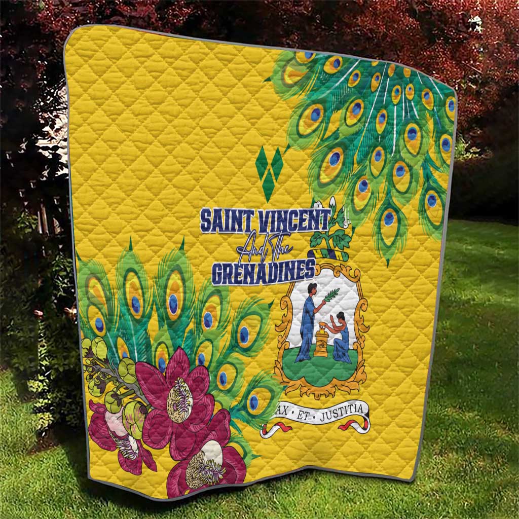Yellow quilt with peacock feather corner accents and large magenta floral print