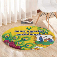 Yellow round rug with peacock-feather graphics and illustrated scene