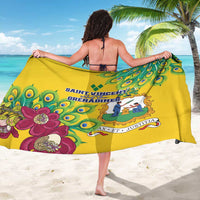 Yellow sarong showing peacock feather print and central crest graphic, back view