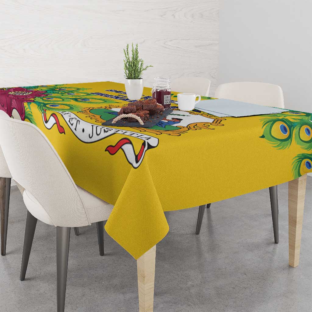 Yellow tablecloth with peacock feather corner print and illustrated edge