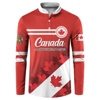 Red Canada button sweatshirt with white stripes and maple leaf crest graphic, long sleeves