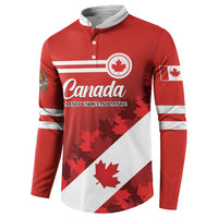 Red long-sleeve button sweatshirt with Canada maple leaf crest and white striped band