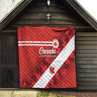 Red Canada blanket with white diagonal flag stripe and quilted diamond stitching