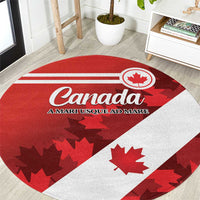 Round carpet with red/white Canada flag design, Canada text, maple leaf emblem (top view)