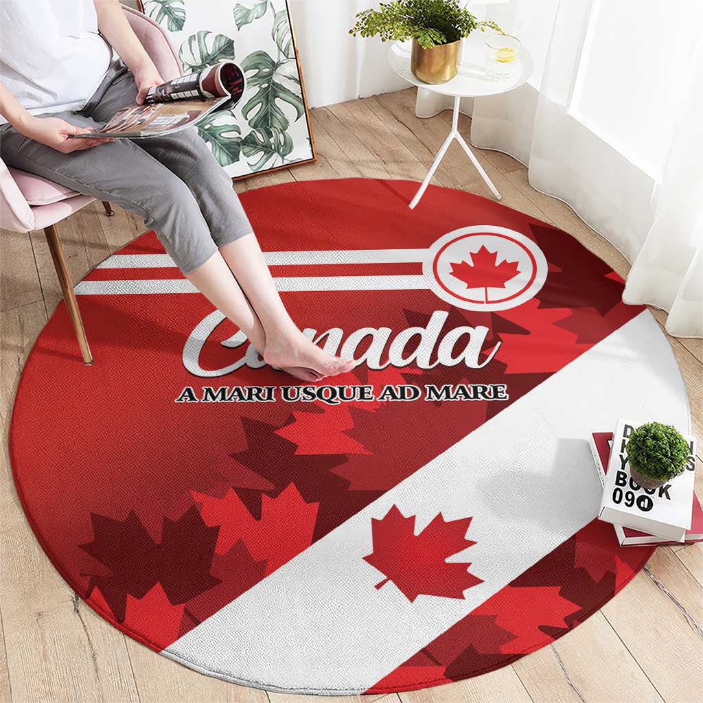 Round carpet with red and white Canada flag stripes, Canada script, maple leaf silhouettes
