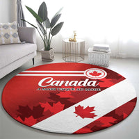 Red and white round Canada carpet with maple leaf pattern and Canada lettering