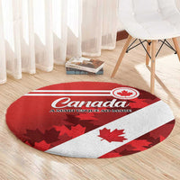 Round red-and-white carpet with Canada lettering and maple leaf graphic, flat on floor