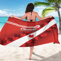 Red and white Canada sarong spread wide with maple leaf graphics and diagonal stripes