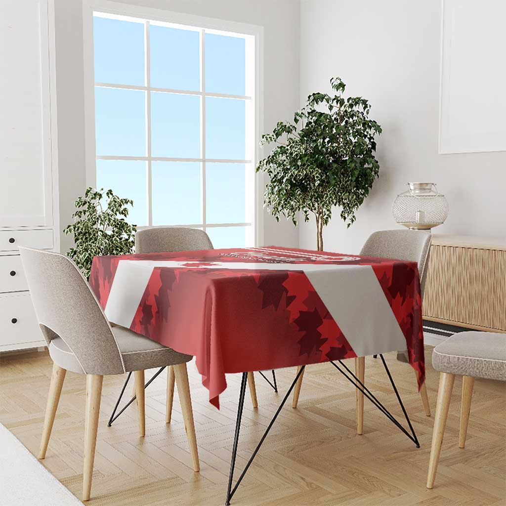 Red tablecloth on dining table with maple leaf pattern and white diagonal band