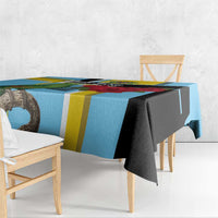 Sky blue tablecloth with yellow stripes and dark corner panel, draped over bench