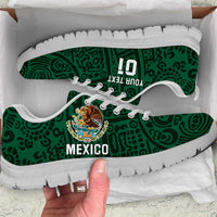 Green football sneakers with white soles, Mexico graphic, lace-up style.