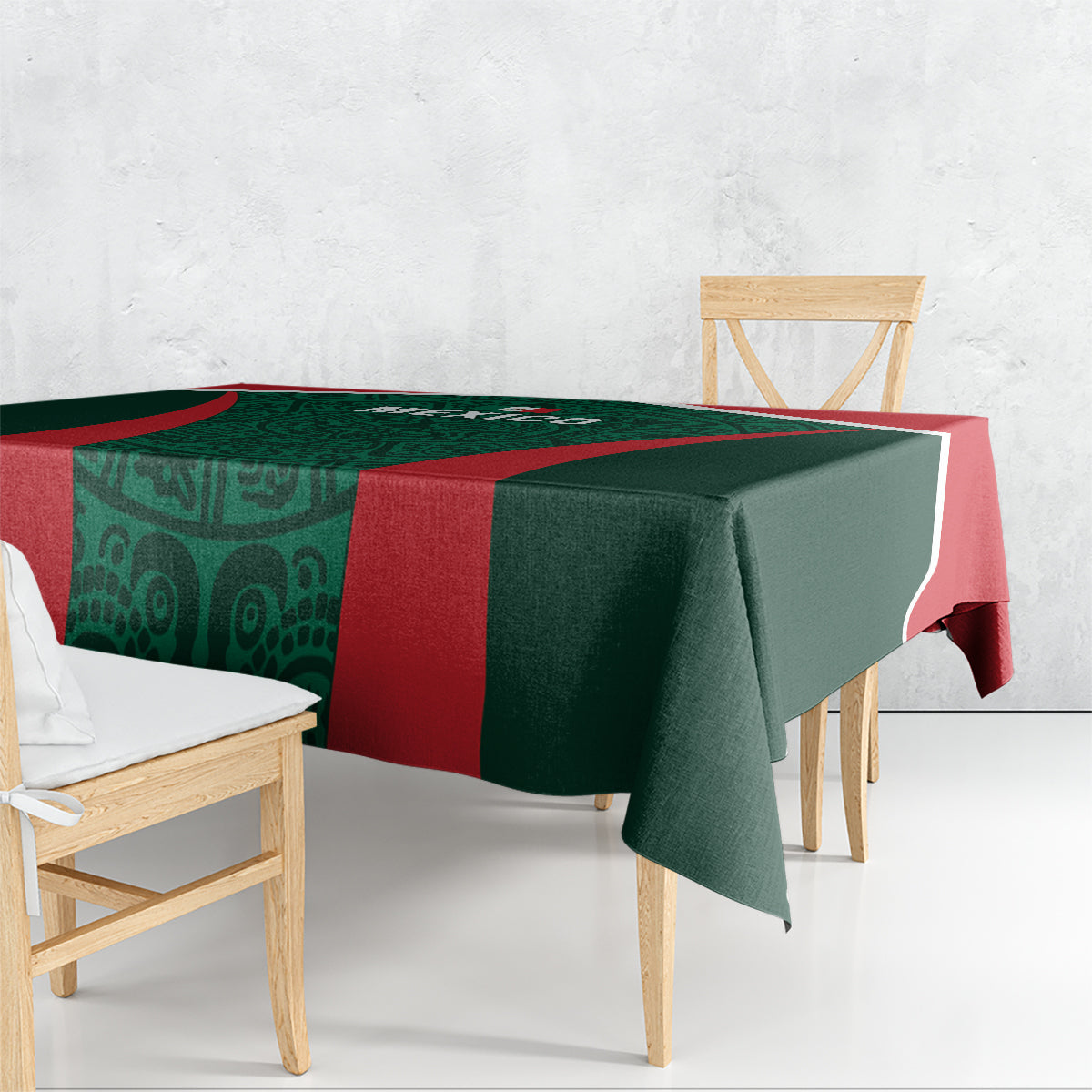 Green tablecloth with red side band, draped over dining table in angled view
