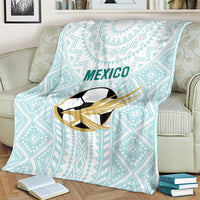 Mint Mexico football blanket with 'MEXICO' text and eagle-soccer emblem, laid on couch