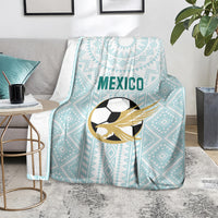 Mint Mexico football blanket with eagle-soccer emblem and geometric pattern on floor
