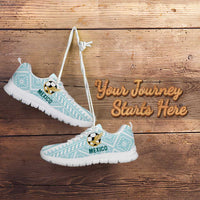 Mint lace-up football sneakers with white sole and soccer emblem, 'MEXICO' lettering