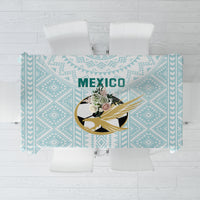 Mint tablecloth with geometric pattern and centered Mexico crest graphic