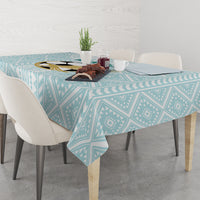 Mint geometric tablecloth with overhang on a dining table setting