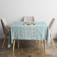 Mint geometric tablecloth on a small table with chairs
